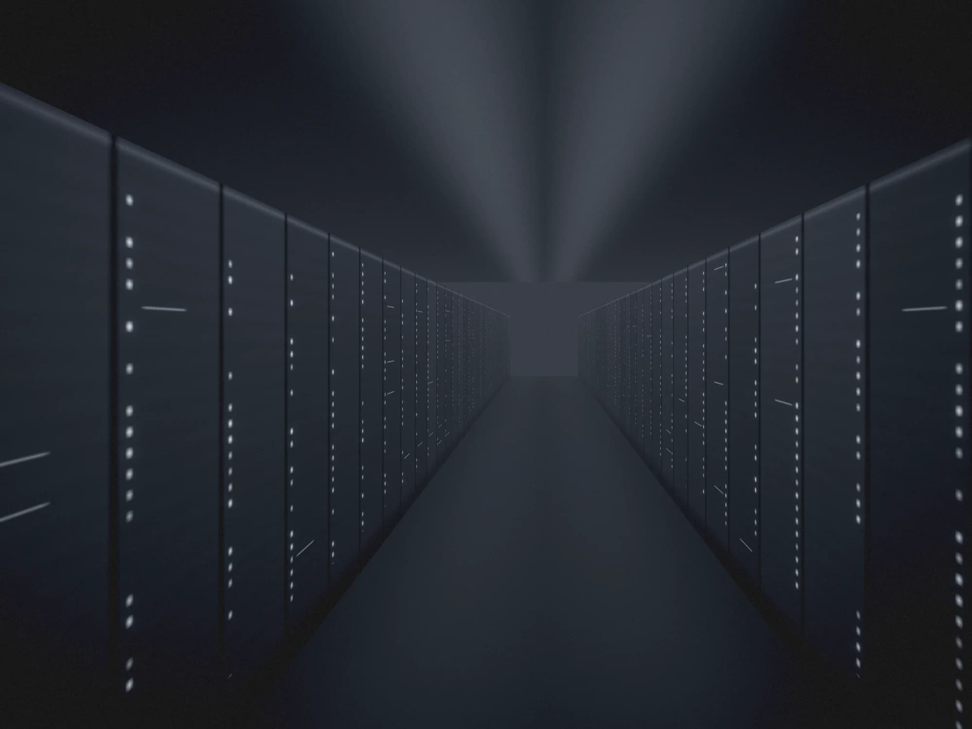 A dark data hall at night: two rows of cabinets receding into haze, their status lights the only thing lit.